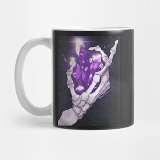 Glowing Purple crystal in a skeletons hand Mug